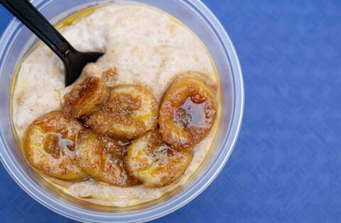 A creamy Jamaican porridge topped with golden caramelized banana slices