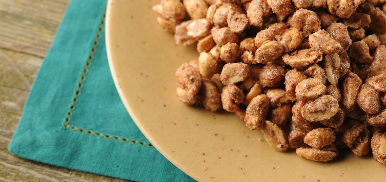a plate full of sugar glazed peanuts.