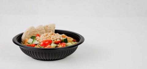 a plastic container full of nuts