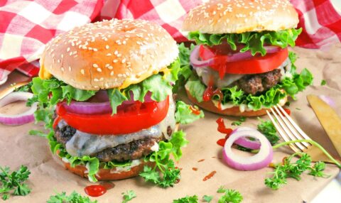 a tall burger with meat