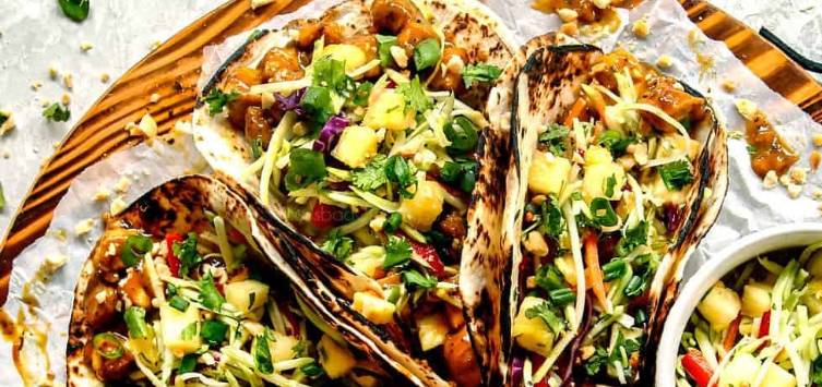 plate of tacos filled with diced chicken