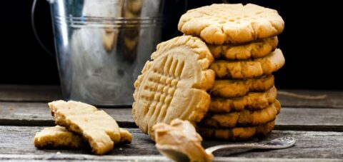 a stack of cookies sitting on top of a wooden table.